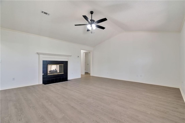1762 Oxford Pl, Springdale, AR 72764 - unfurnished living room featuring a ceiling fan, lofted ceiling, wood finished floors, a fireplace, and baseboards