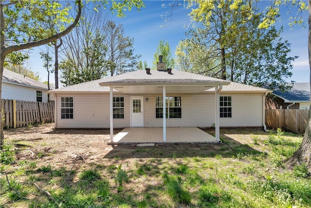 1762 Oxford Pl, Springdale, AR 72764 - back of property featuring a patio area and a chimney