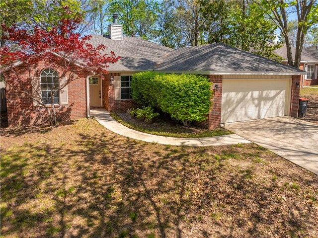 1762 Oxford Pl, Springdale, AR 72764 - ranch-style house featuring brick siding, an attached garage, concrete driveway, and a chimney