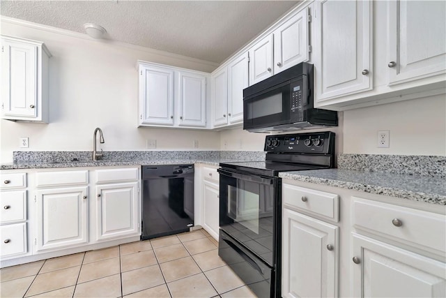 1740 Oxford Pl, Springdale, AR 72764 - kitchen featuring black appliances, white cabinetry, a sink, light tile patterned floors, and a textured ceiling