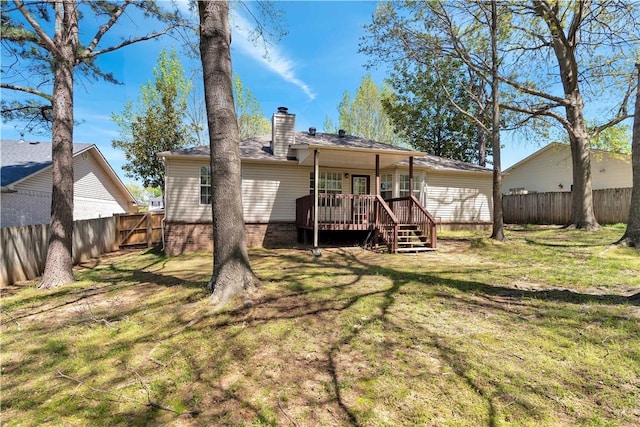 1765 Oxford Pl, Springdale, AR 72764 - rear view of house with a wooden deck and a chimney