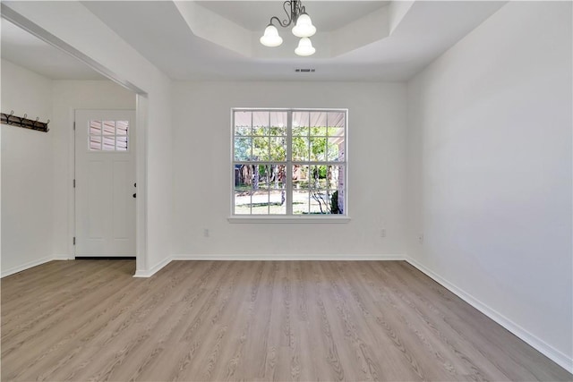 1765 Oxford Pl, Springdale, AR 72764 - unfurnished dining area featuring wood finished floors, a chandelier, baseboards, and a raised ceiling