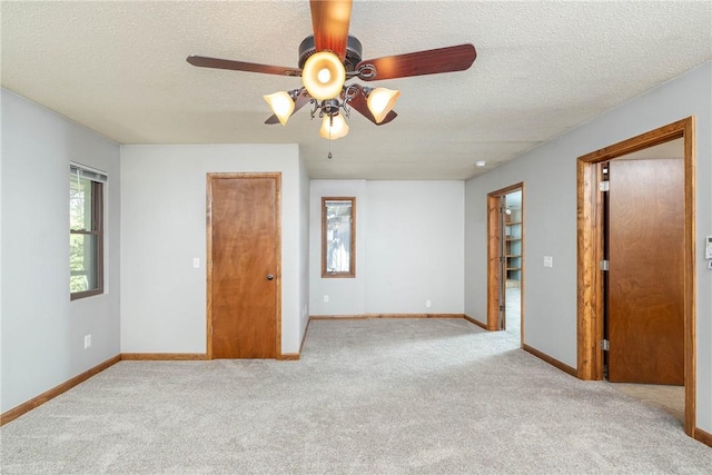 19584 Neills Bluff Rd, Springdale, AR 72764 - carpeted empty room featuring a ceiling fan, a textured ceiling, and baseboards