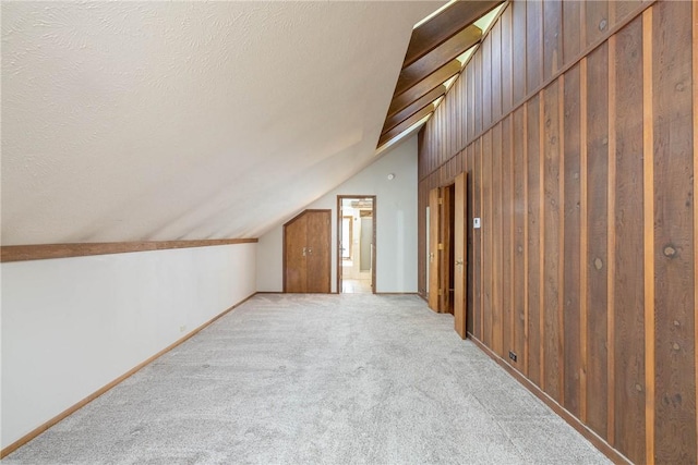 19584 Neills Bluff Rd, Springdale, AR 72764 - bonus room featuring vaulted ceiling, light colored carpet, and baseboards