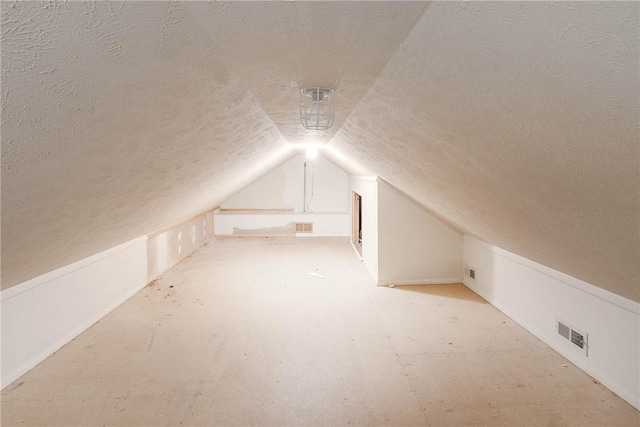 19584 Neills Bluff Rd, Springdale, AR 72764 - additional living space featuring a textured ceiling and vaulted ceiling