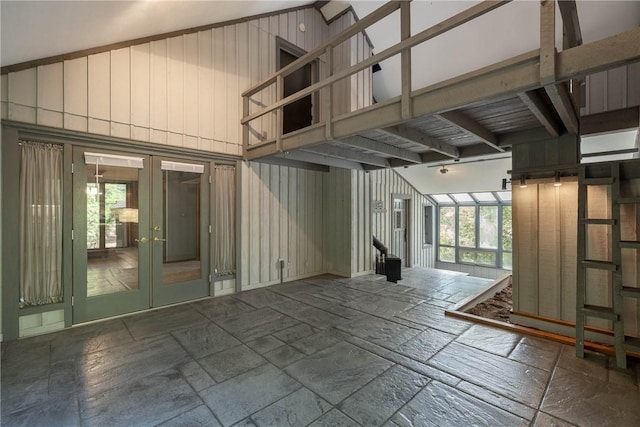 19584 Neills Bluff Rd, Springdale, AR 72764 - empty room with french doors, stone tile floors, and a high ceiling