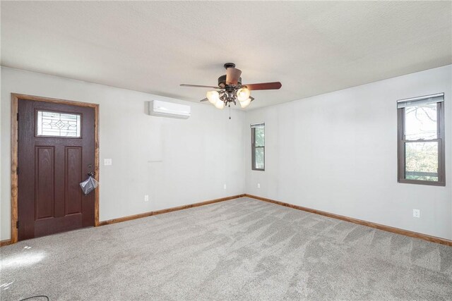 19584 Neills Bluff Rd, Springdale, AR 72764 - carpeted spare room featuring an AC wall unit, baseboards, and ceiling fan