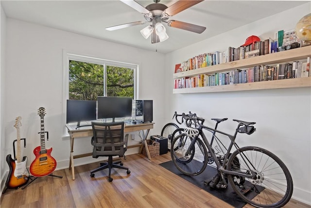office area featuring a ceiling fan and wood finished floors
