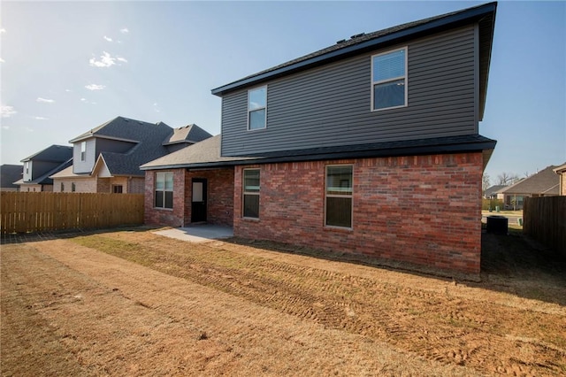 7104 SW High Meadow Blvd, Bentonville, AR 72713 - back of property with brick siding and a patio area
