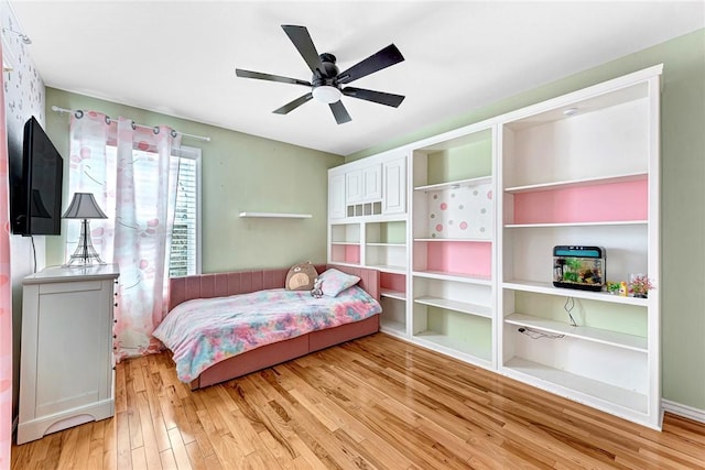 bedroom featuring a ceiling fan and light wood finished floors