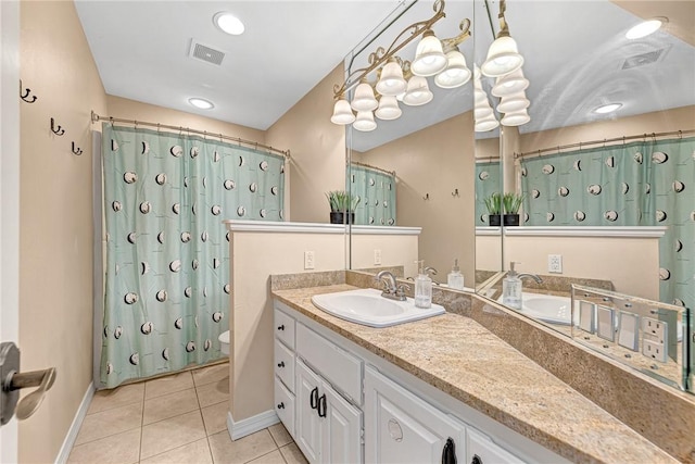 bathroom featuring tile patterned flooring, visible vents, vanity, a shower with curtain, and baseboards
