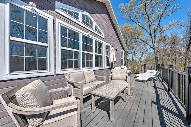 wooden terrace featuring outdoor lounge area