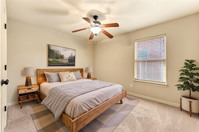 4004 SW Banbury Dr, Bentonville, AR 72713 - bedroom with light colored carpet, baseboards, and a ceiling fan