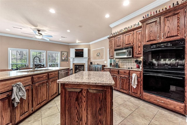 13708 Crazy Horse Dr, Rogers, AR 72758 - kitchen with recessed lighting, light stone countertops, stainless steel appliances, and a sink