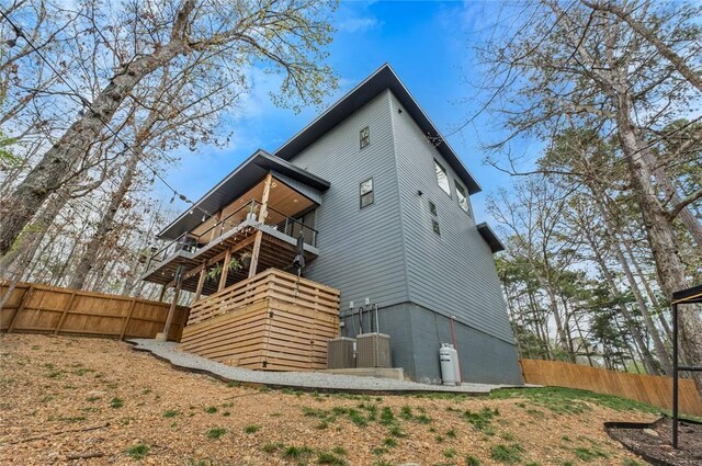 4 Shap Ln, Bella Vista, AR 72714 - rear view of property with a fenced backyard and a balcony