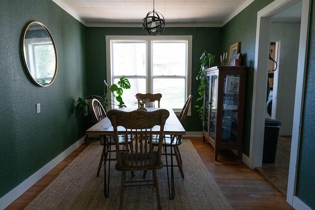 406 N Oak St, Harrison, AR 72601 - dining room with a textured wall, baseboards, and wood finished floors