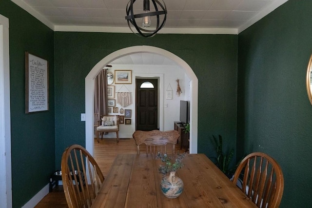 406 N Oak St, Harrison, AR 72601 - dining space with arched walkways, wood finished floors, and baseboards