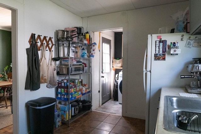 406 N Oak St, Harrison, AR 72601 - kitchen with washer / dryer and freestanding refrigerator