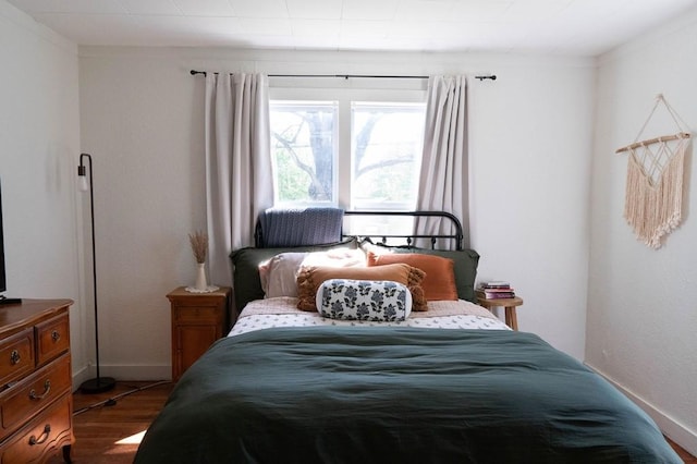 406 N Oak St, Harrison, AR 72601 - bedroom with baseboards and wood finished floors