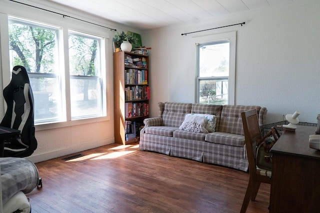 406 N Oak St, Harrison, AR 72601 - living area featuring visible vents, baseboards, and wood finished floors