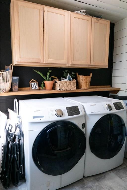 406 N Oak St, Harrison, AR 72601 - washroom with separate washer and dryer, wood walls, and cabinet space