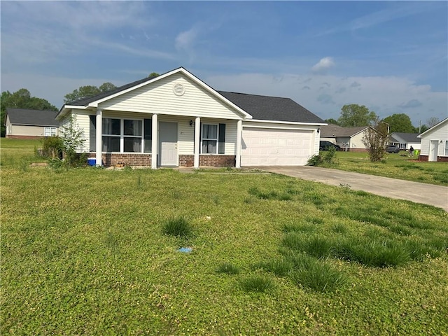 ranch-style home featuring an attached garage, brick siding, a front yard, and concrete driveway