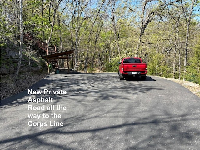 826 Cobblestone Ln, Eureka Springs, AR 72631 - view of street featuring a wooded view