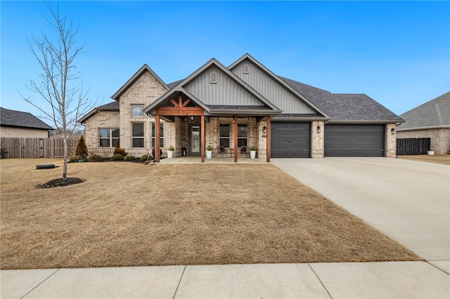 view of front of property with a porch, board and batten siding, brick siding, fence, and an attached garage
