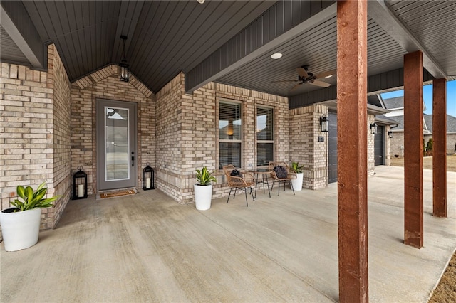 view of patio with a ceiling fan and a porch