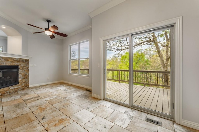 entryway featuring crown molding, a healthy amount of sunlight, visible vents, and ceiling fan