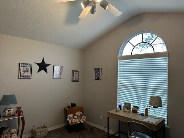 office area with ceiling fan, vaulted ceiling, carpet flooring, and baseboards