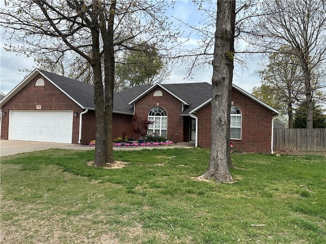 ranch-style house with an attached garage, brick siding, fence, and driveway