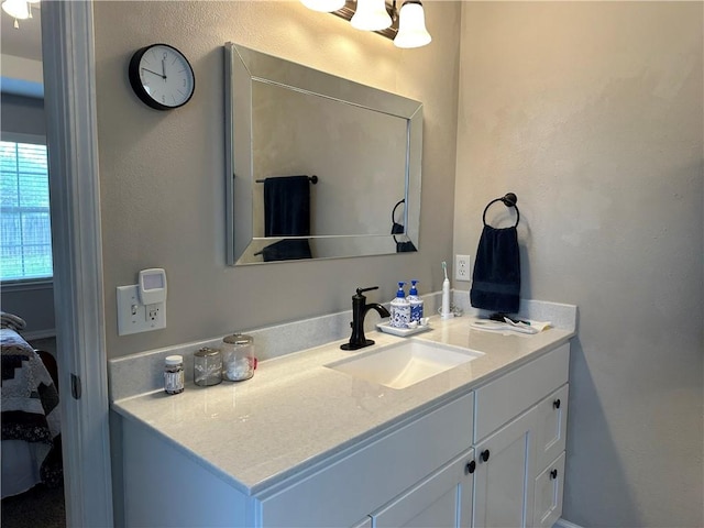 ensuite bathroom with ensuite bath and vanity