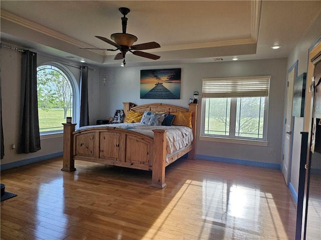 21854 S Floyd Moore Rd, Gentry, AR 72734 - bedroom featuring a tray ceiling, crown molding, wood finished floors, baseboards, and recessed lighting