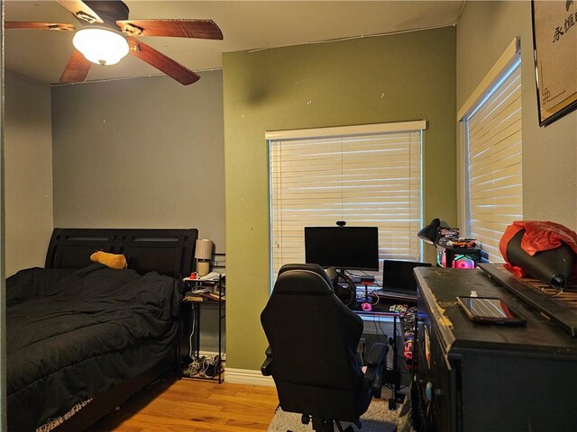 21854 S Floyd Moore Rd, Gentry, AR 72734 - bedroom with wood finished floors, an office area, and ceiling fan