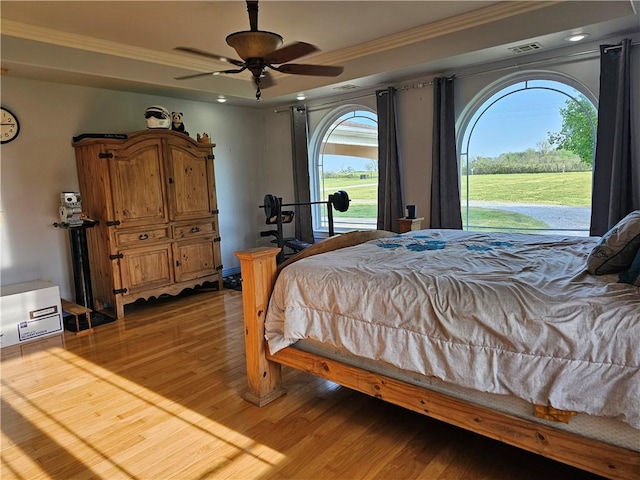 bedroom with light wood-style flooring, access to exterior, visible vents, a ceiling fan, and ornamental molding
