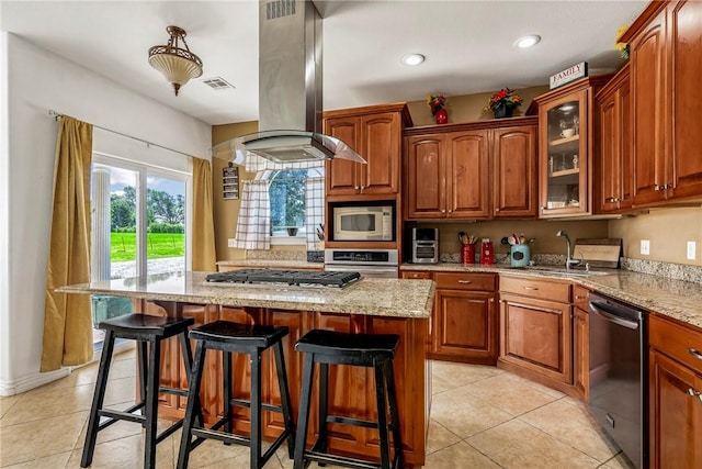 21854 S Floyd Moore Rd, Gentry, AR 72734 - kitchen featuring stainless steel appliances, island exhaust hood, a sink, light stone counters, and light tile patterned floors