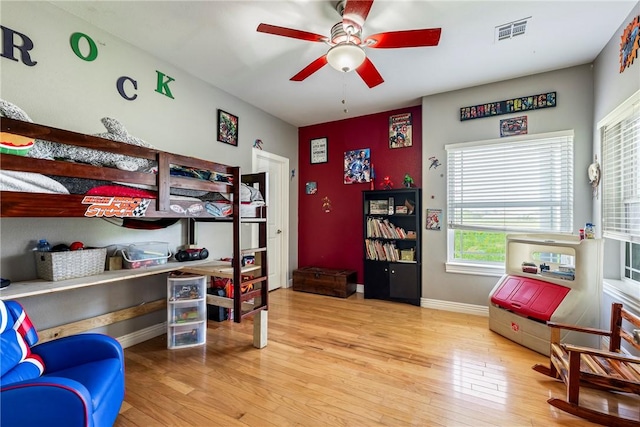 21854 S Floyd Moore Rd, Gentry, AR 72734 - bedroom featuring wood-type flooring, baseboards, and a ceiling fan