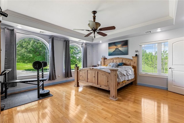 21854 S Floyd Moore Rd, Gentry, AR 72734 - bedroom with a raised ceiling, crown molding, light wood-type flooring, multiple windows, and recessed lighting