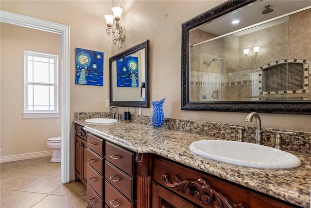 21854 S Floyd Moore Rd, Gentry, AR 72734 - full bath featuring tiled shower, double vanity, baseboards, toilet, and tile patterned flooring