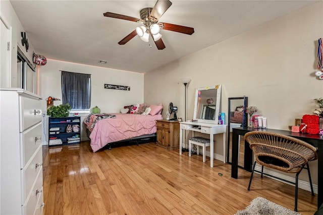 21854 S Floyd Moore Rd, Gentry, AR 72734 - bedroom with wood finished floors and a ceiling fan