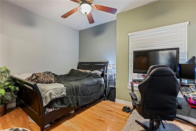 21854 S Floyd Moore Rd, Gentry, AR 72734 - bedroom featuring wood finished floors, baseboards, and a ceiling fan