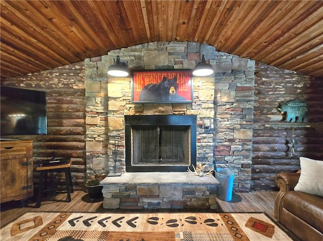 living area with wood-type flooring, lofted ceiling, and wooden ceiling