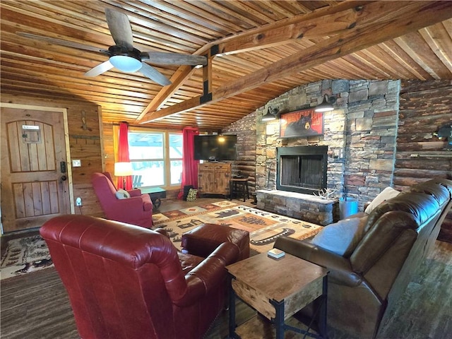 living area with wood ceiling, vaulted ceiling with beams, a stone fireplace, and a ceiling fan