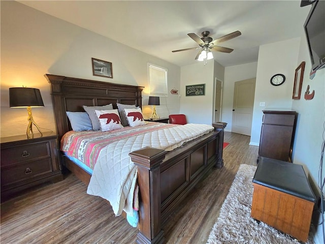 bedroom featuring a ceiling fan and dark wood-style flooring
