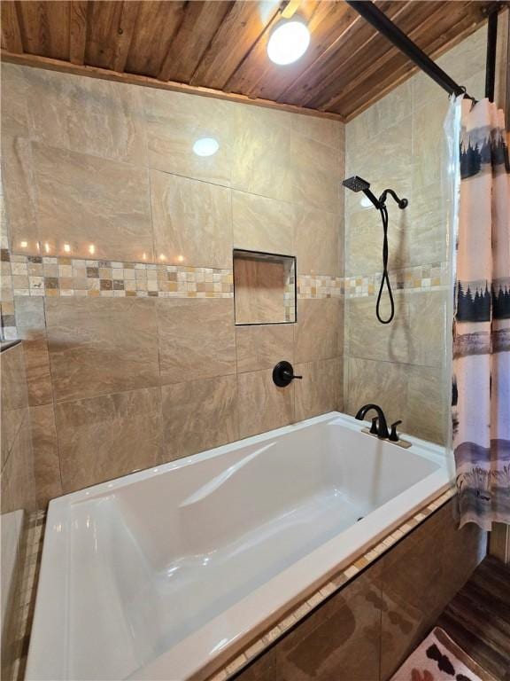 bathroom featuring wood ceiling and tiled shower / bath combo