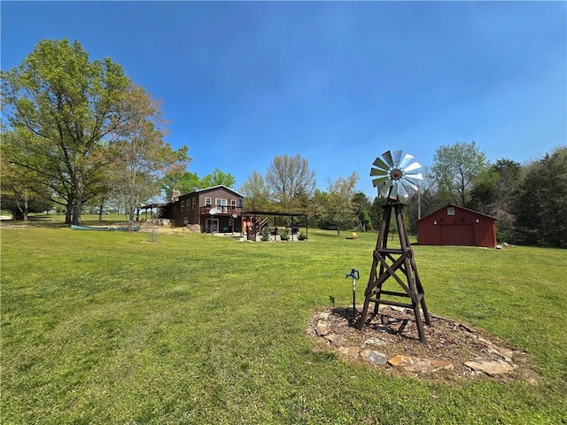 view of yard featuring an outbuilding and a barn