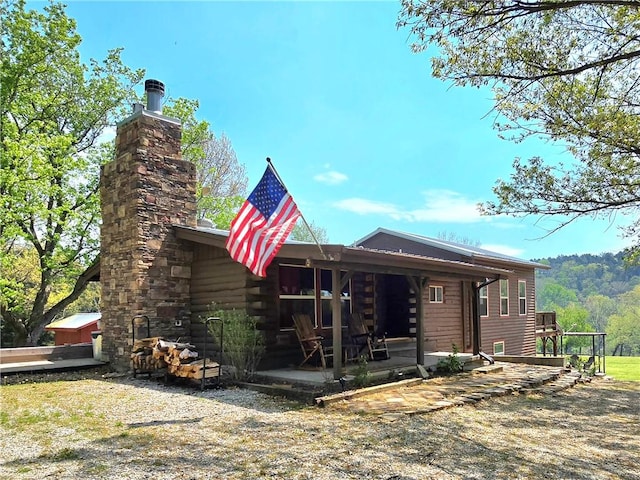rear view of property with a patio area