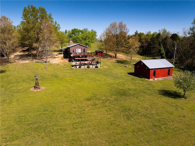 view of yard featuring an outbuilding and a deck