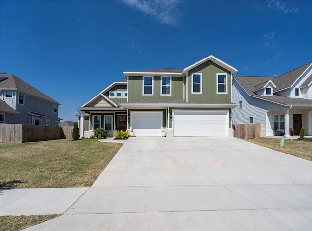 craftsman house with an attached garage, driveway, a front lawn, and fence